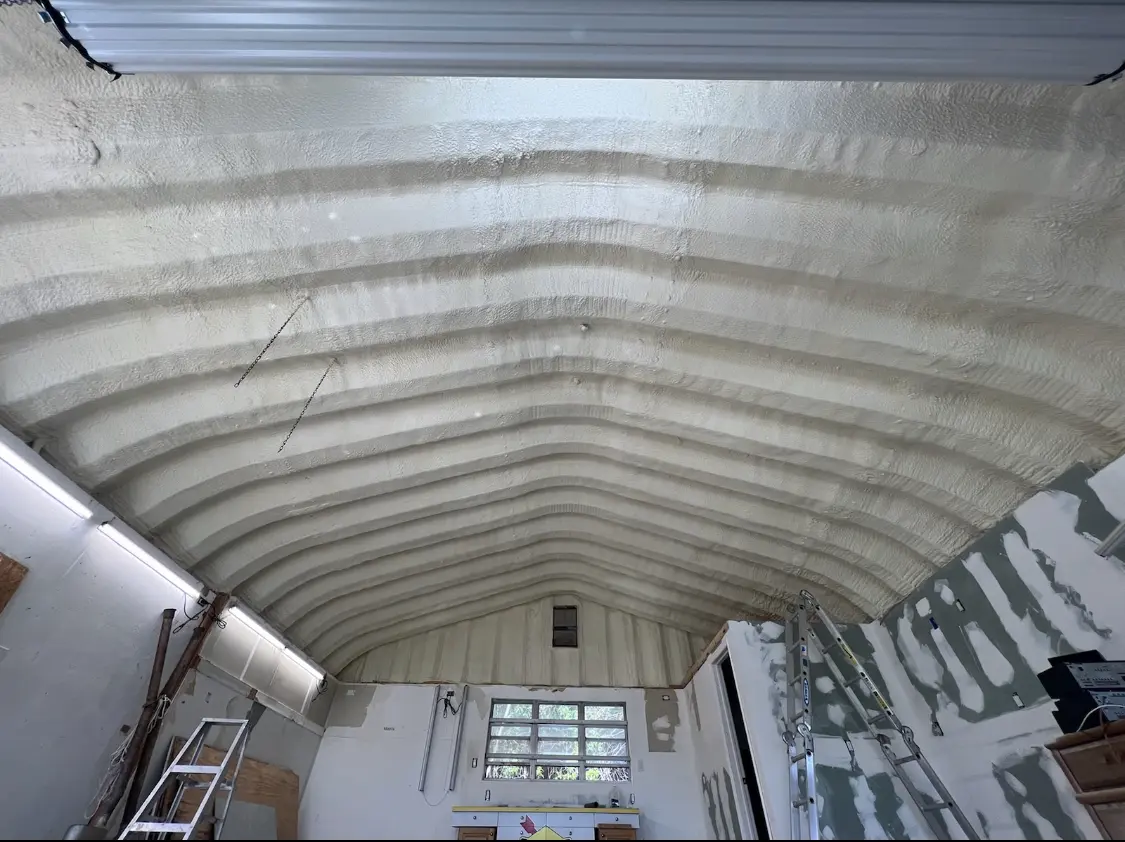 Spray polyurethane foam applied to the underside of a metal roof deck in Littlefield